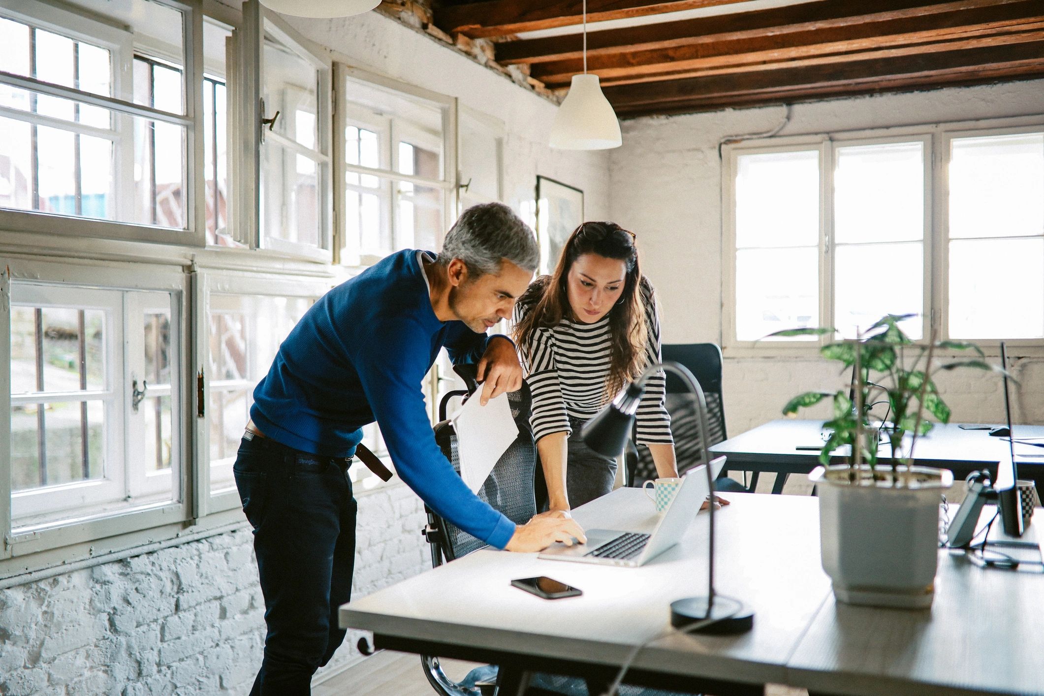 IT professionals collaborating in a modern office
