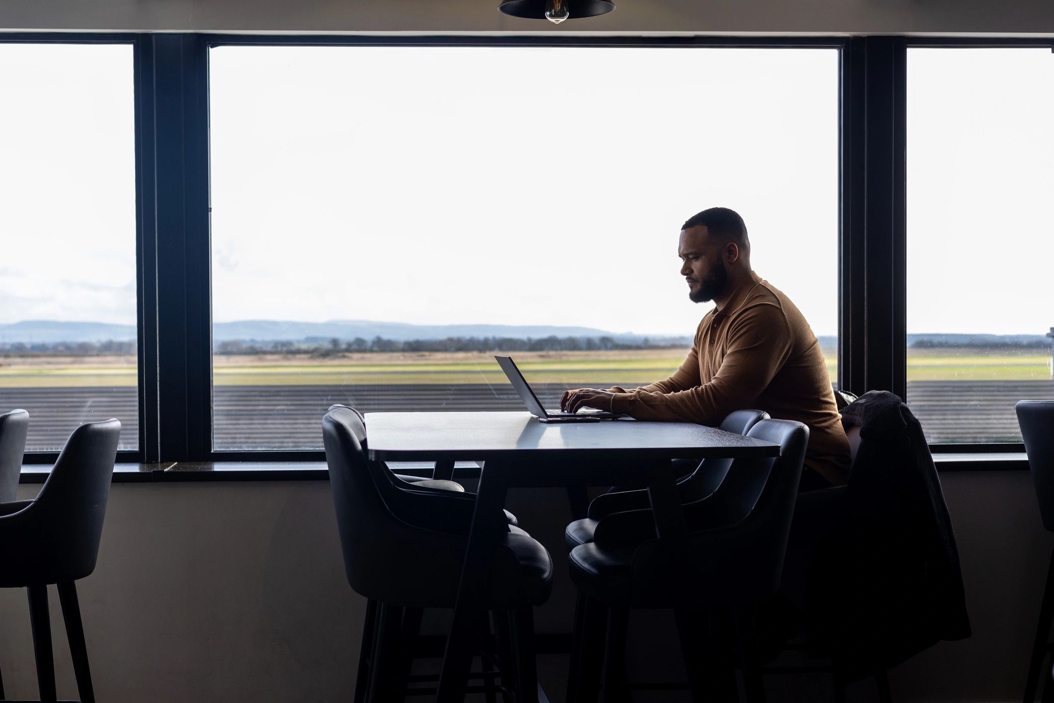 Professional working on a laptop in a quiet workspace