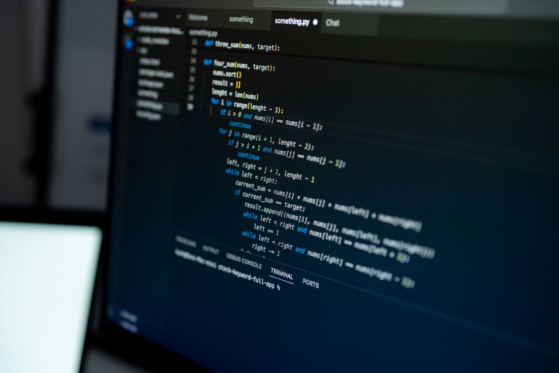 Close-up of software code on a monitor in a technical environment